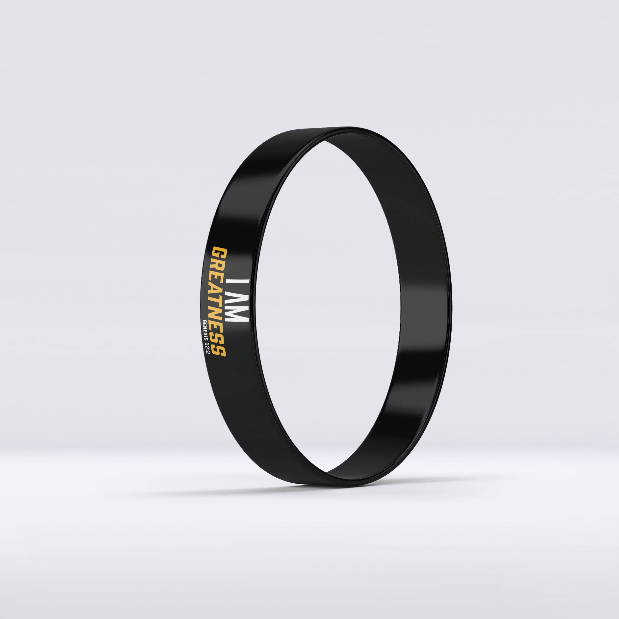 I AM Greatness wristband in black, white, and gold lettering.